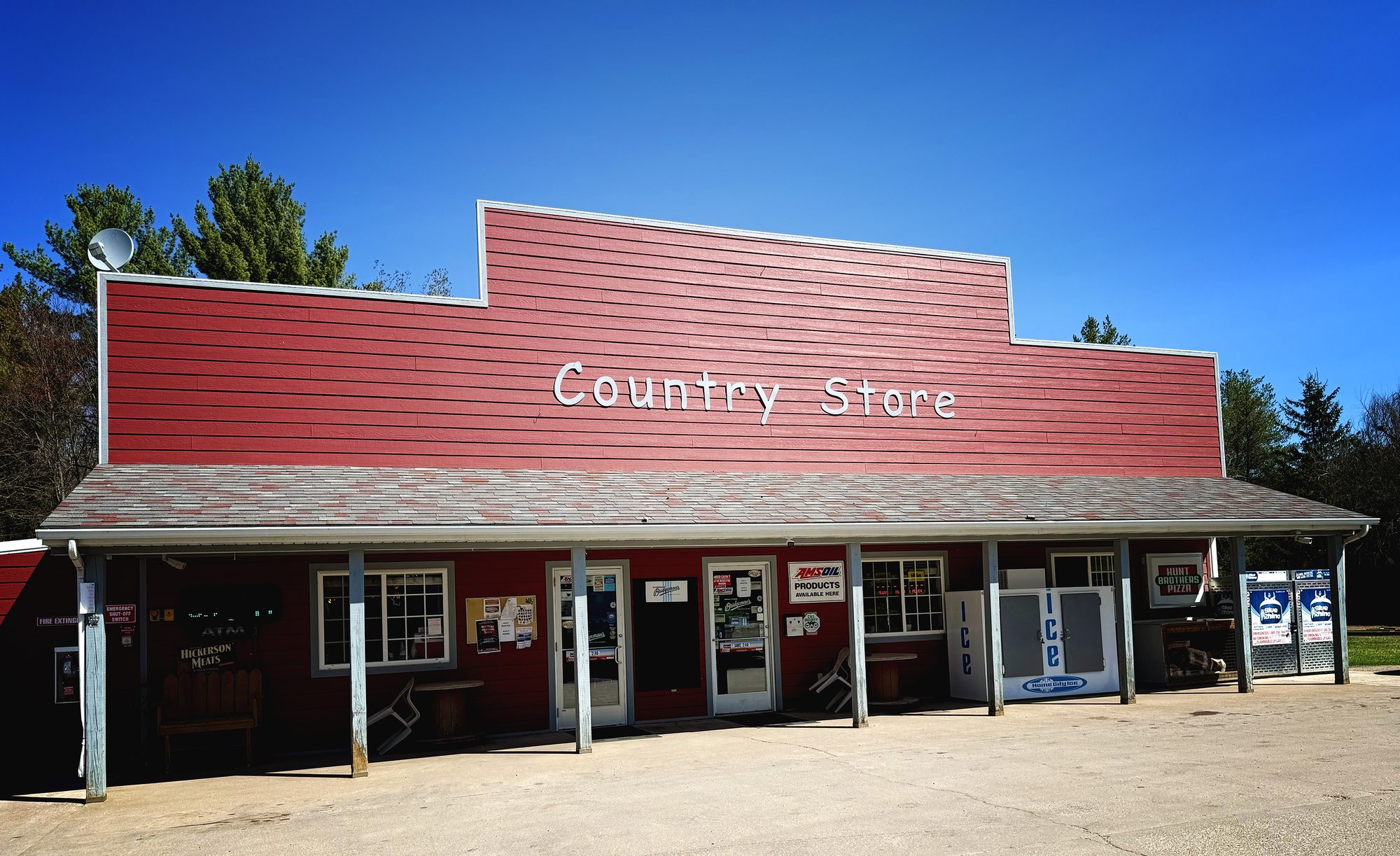 The Country Store, a red wooden building with covered porch in Grantsburg, Wisconsin