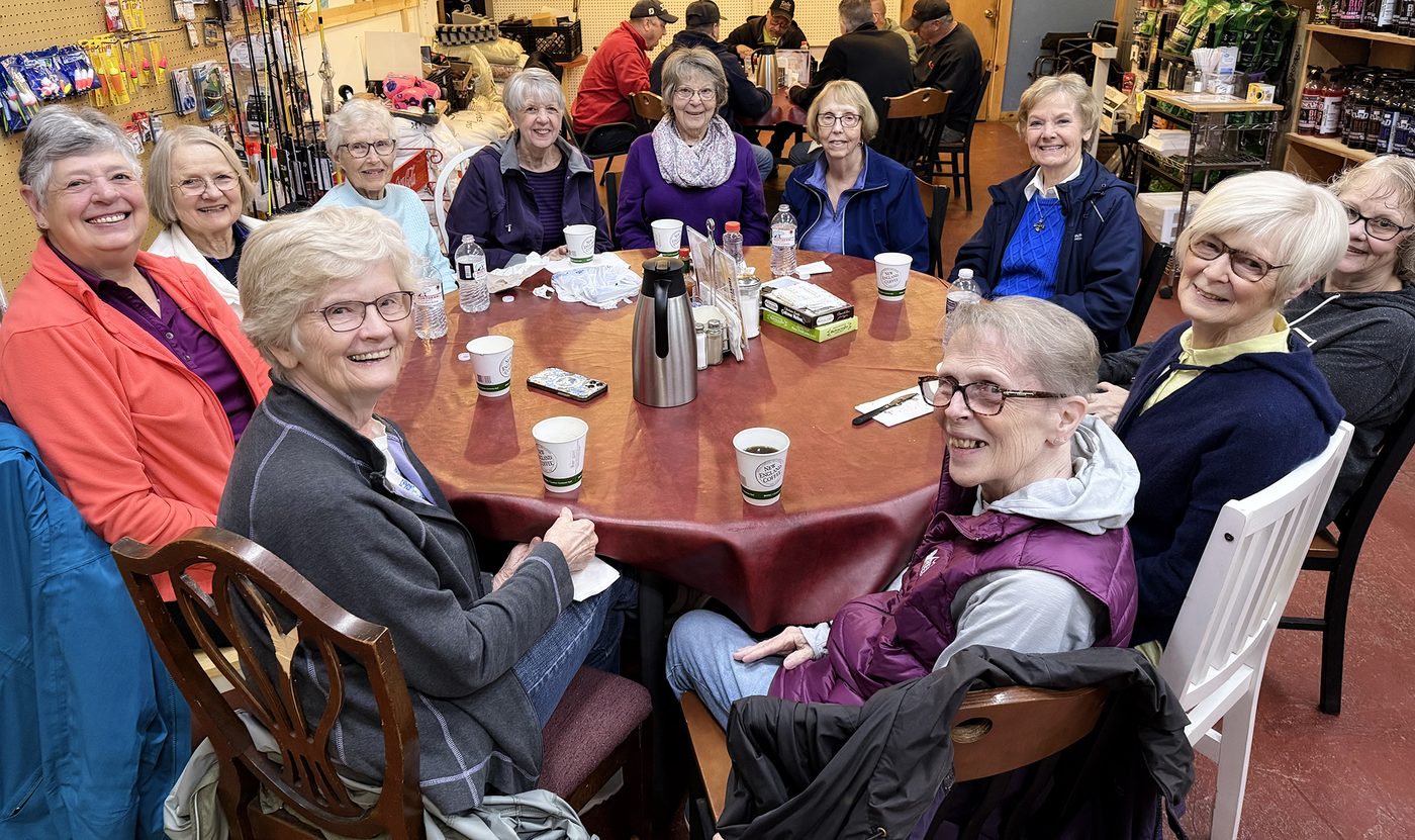 About a dozen of the Country Store's regulars gathered around a table for coffee